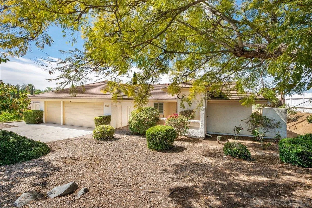 17526 St Andrews Drive Poway, CA 92064 - Photo 3 of 55 a front view of a house with garden
