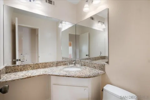 a view of room with a ceiling fan and window