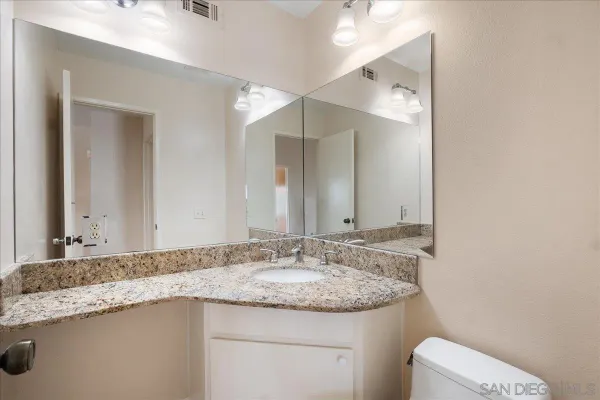 a view of room with a ceiling fan and window
