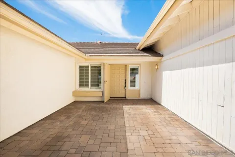 a view of a big room with windows