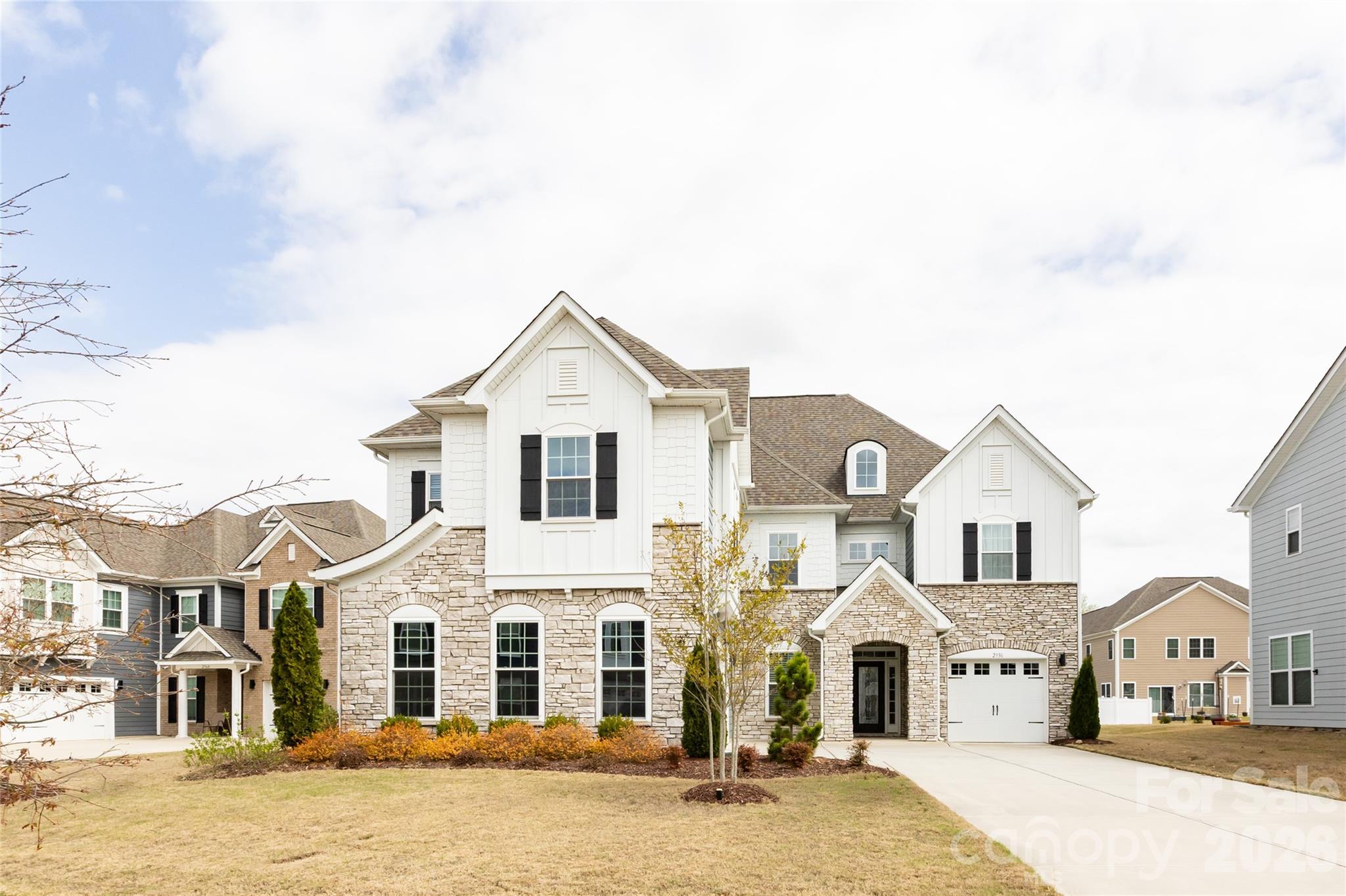 2936 Haley Circle Davidson, NC 28036 - Photo 1 of 45 a front view of a large white house with a yard