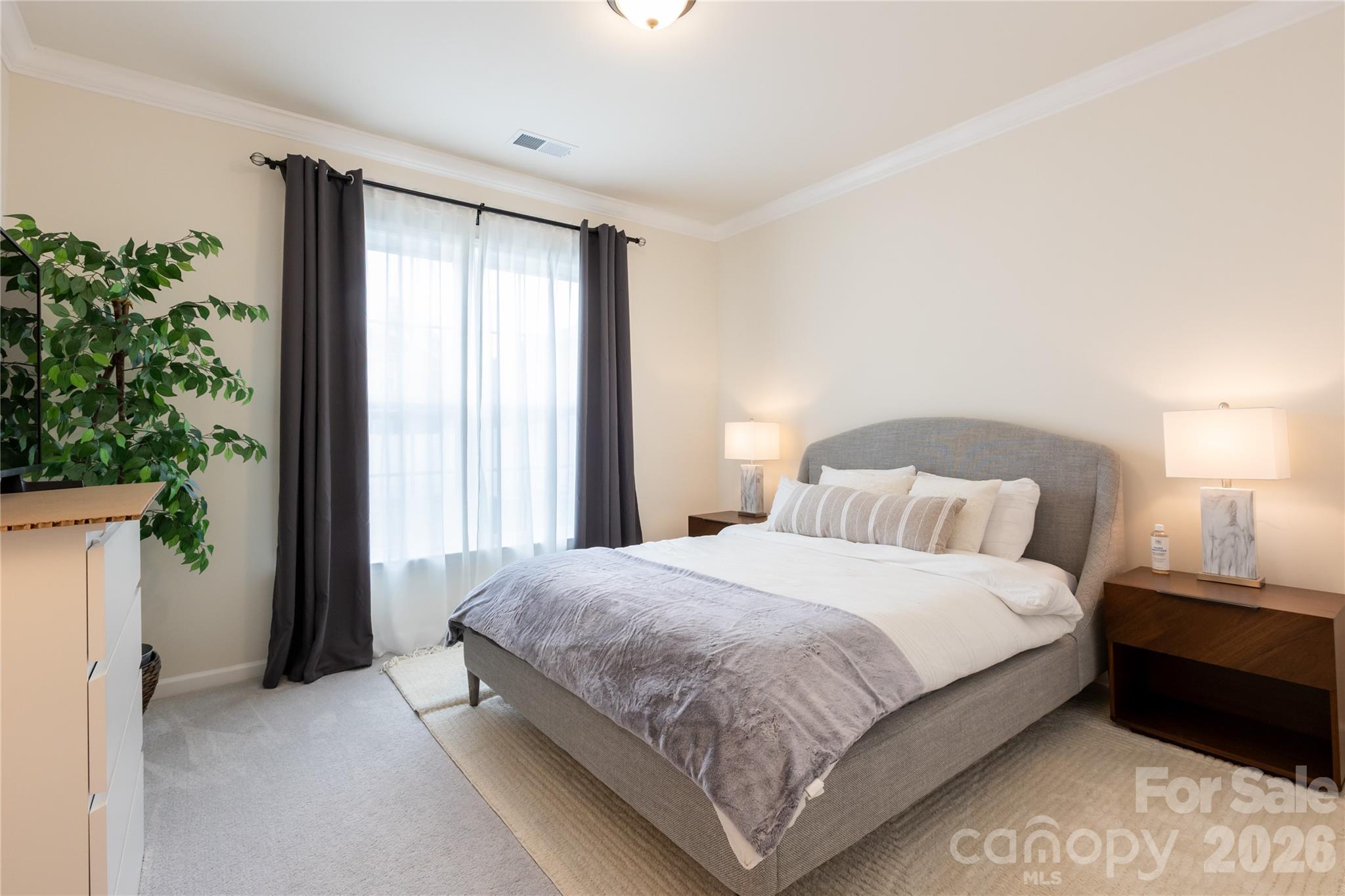 2936 Haley Circle Davidson, NC 28036 - Photo 20 of 45 a bedroom with a bed lamp and a large window