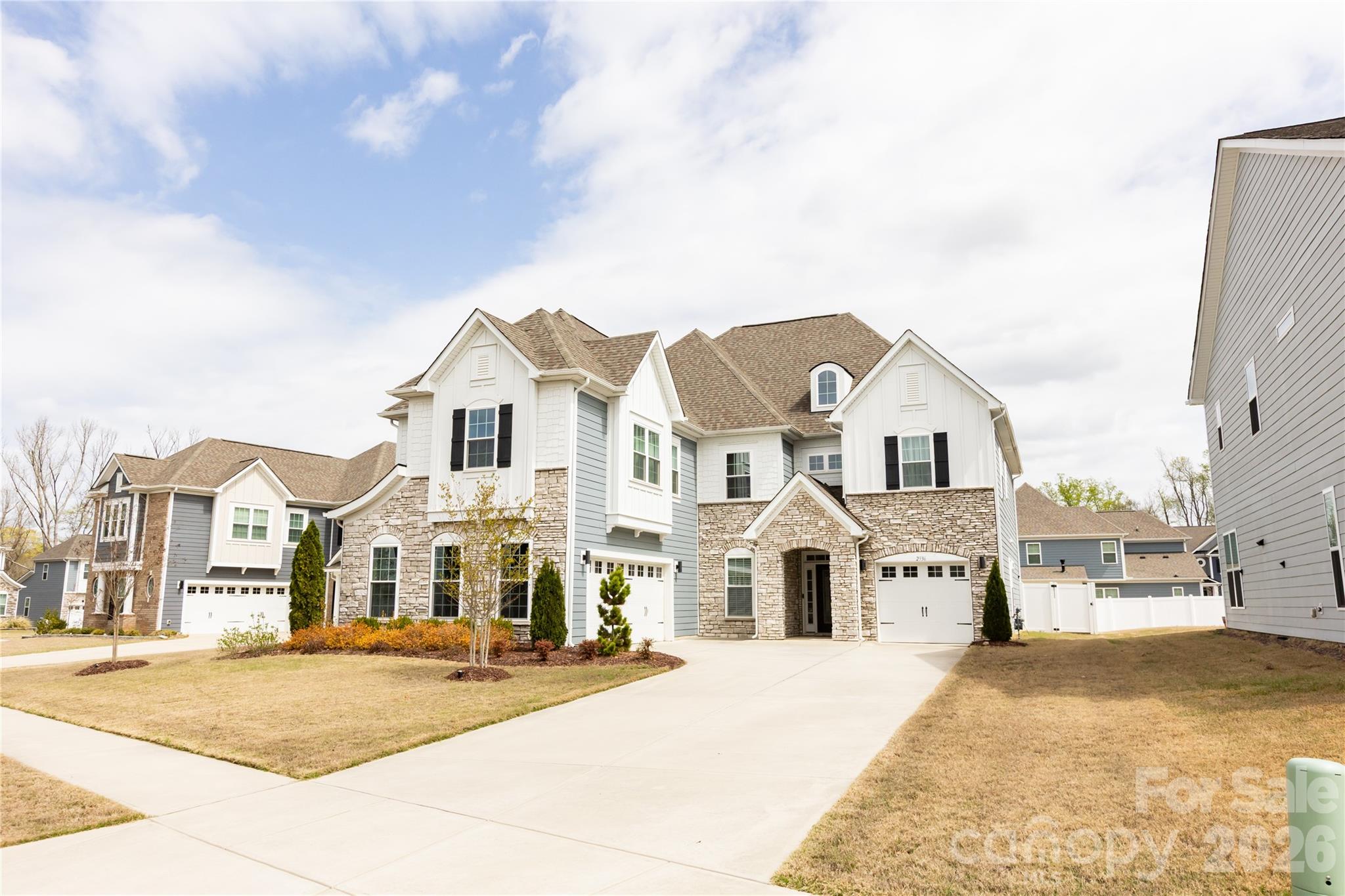 2936 Haley Circle Davidson, NC 28036 - Photo 2 of 45 a view of a white house with a yard