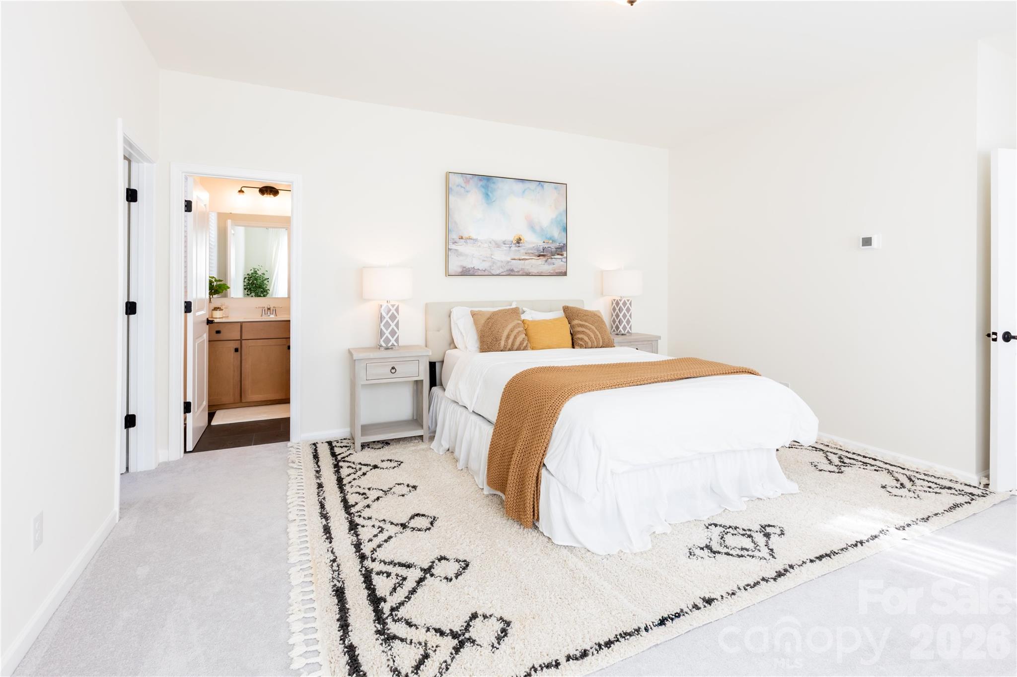 2936 Haley Circle Davidson, NC 28036 - Photo 23 of 45 a bedroom with a large bed and a chandelier
