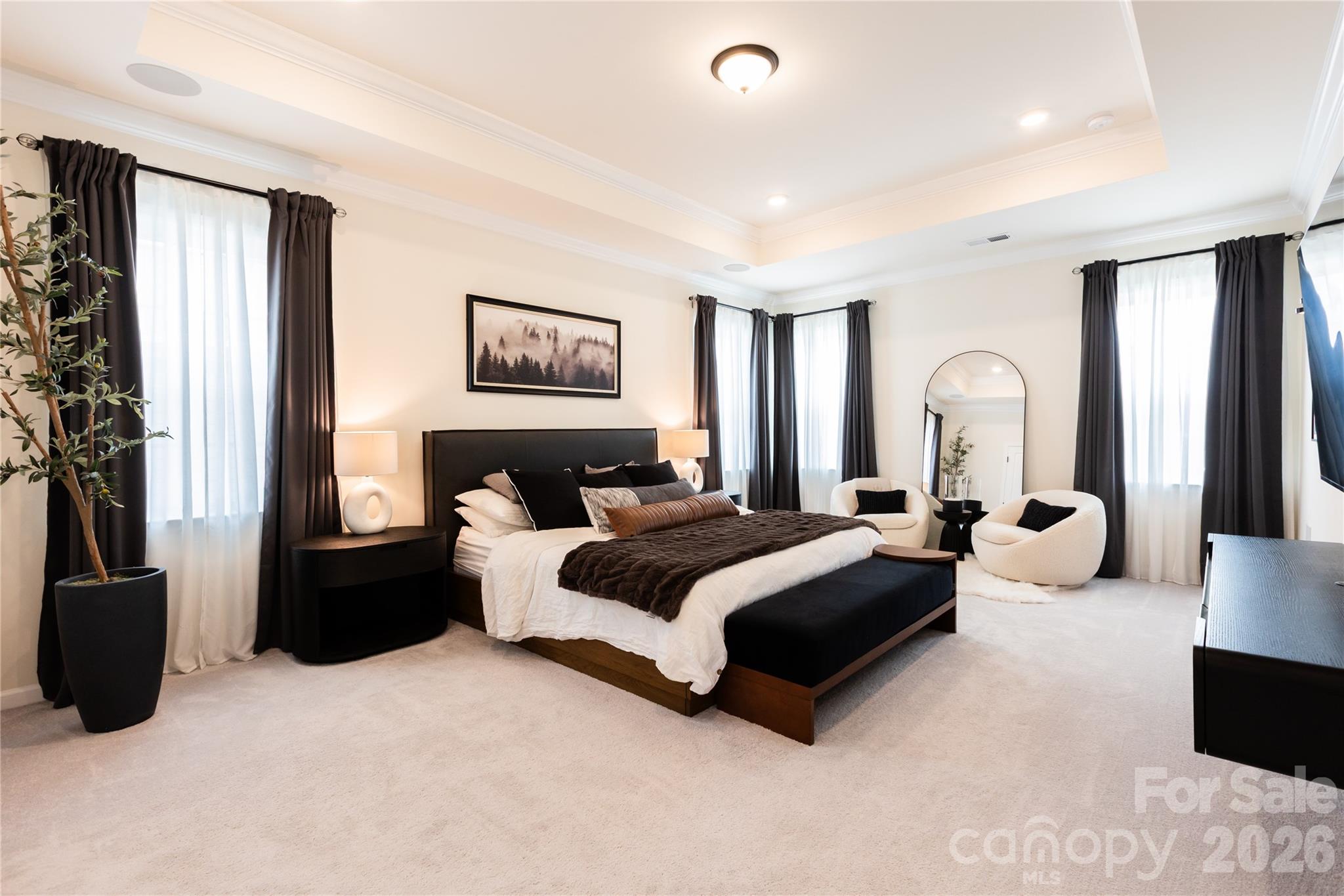 2936 Haley Circle Davidson, NC 28036 - Photo 26 of 45 a spacious bedroom with a bed couch and a large window