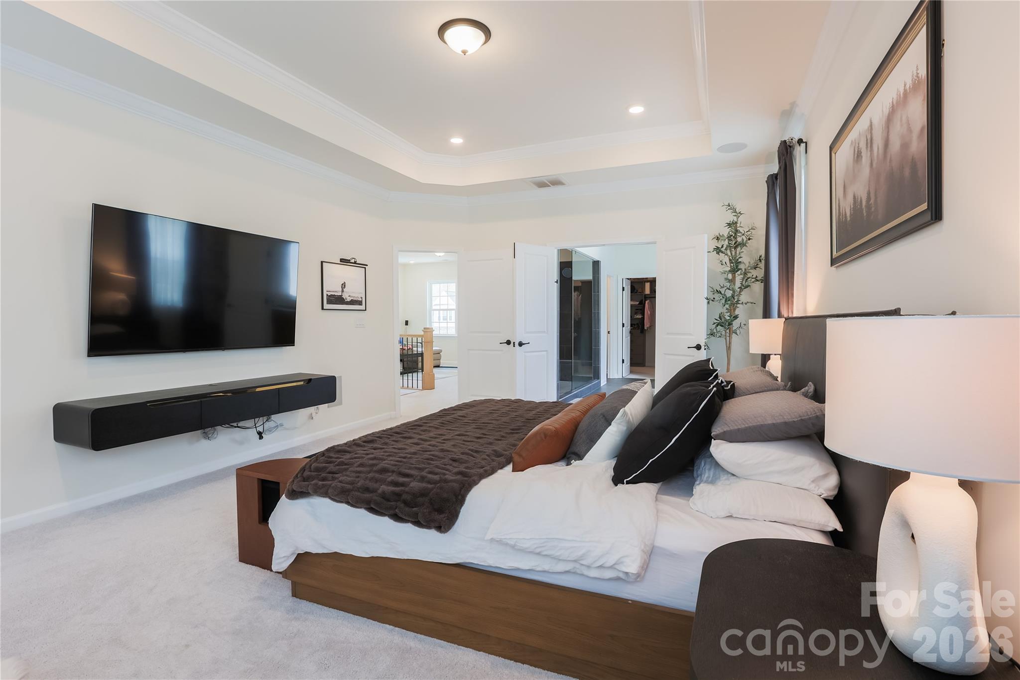 2936 Haley Circle Davidson, NC 28036 - Photo 28 of 45 a bedroom with a bed and a flat screen television
