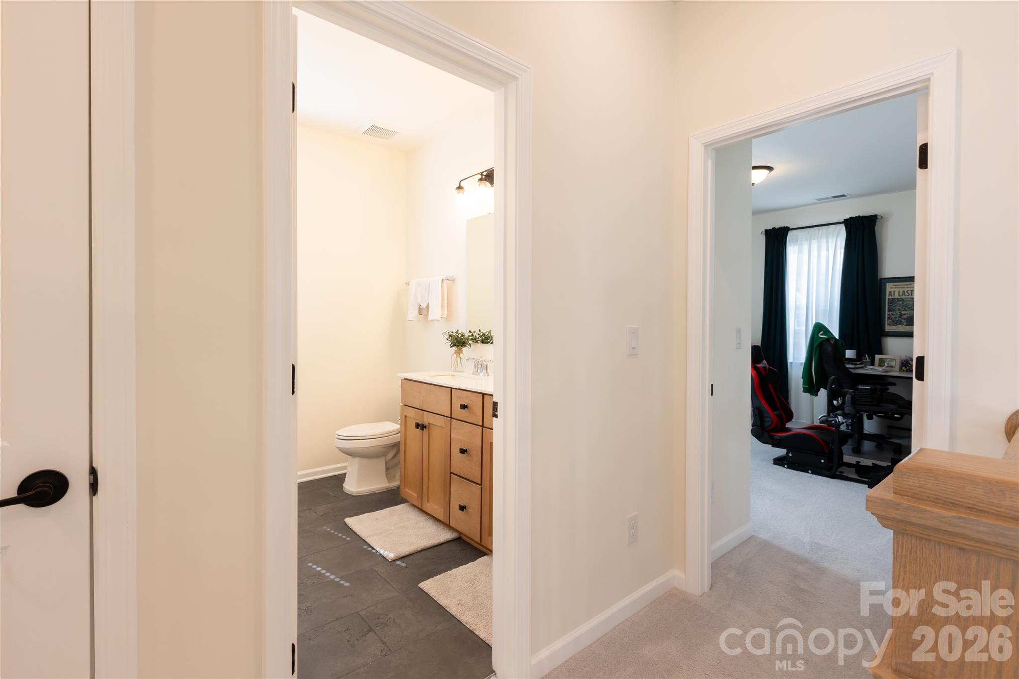 2936 Haley Circle Davidson, NC 28036 - Photo 35 of 45 a bathroom with a sink a toilet and a shower