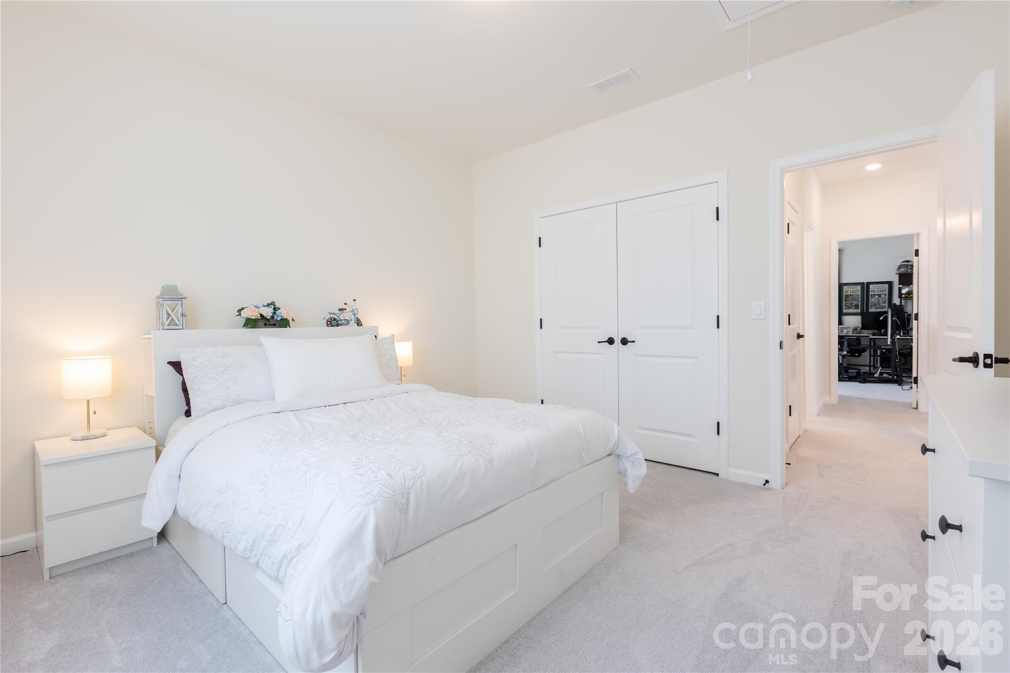 2936 Haley Circle Davidson, NC 28036 - Photo 39 of 45 a spacious bedroom with a bed and walk in closet
