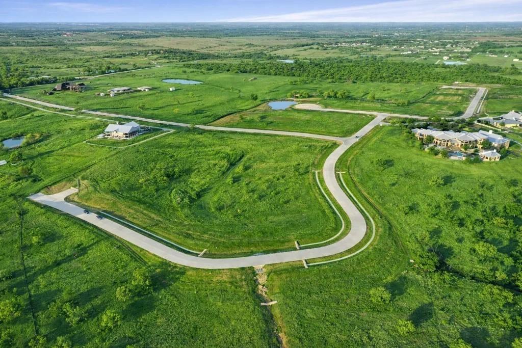 1180 McReynolds Road Sanger, TX 76266 - Photo 4 of 40 Expansive undeveloped land parcels featuring a winding paved road and scattered established homes