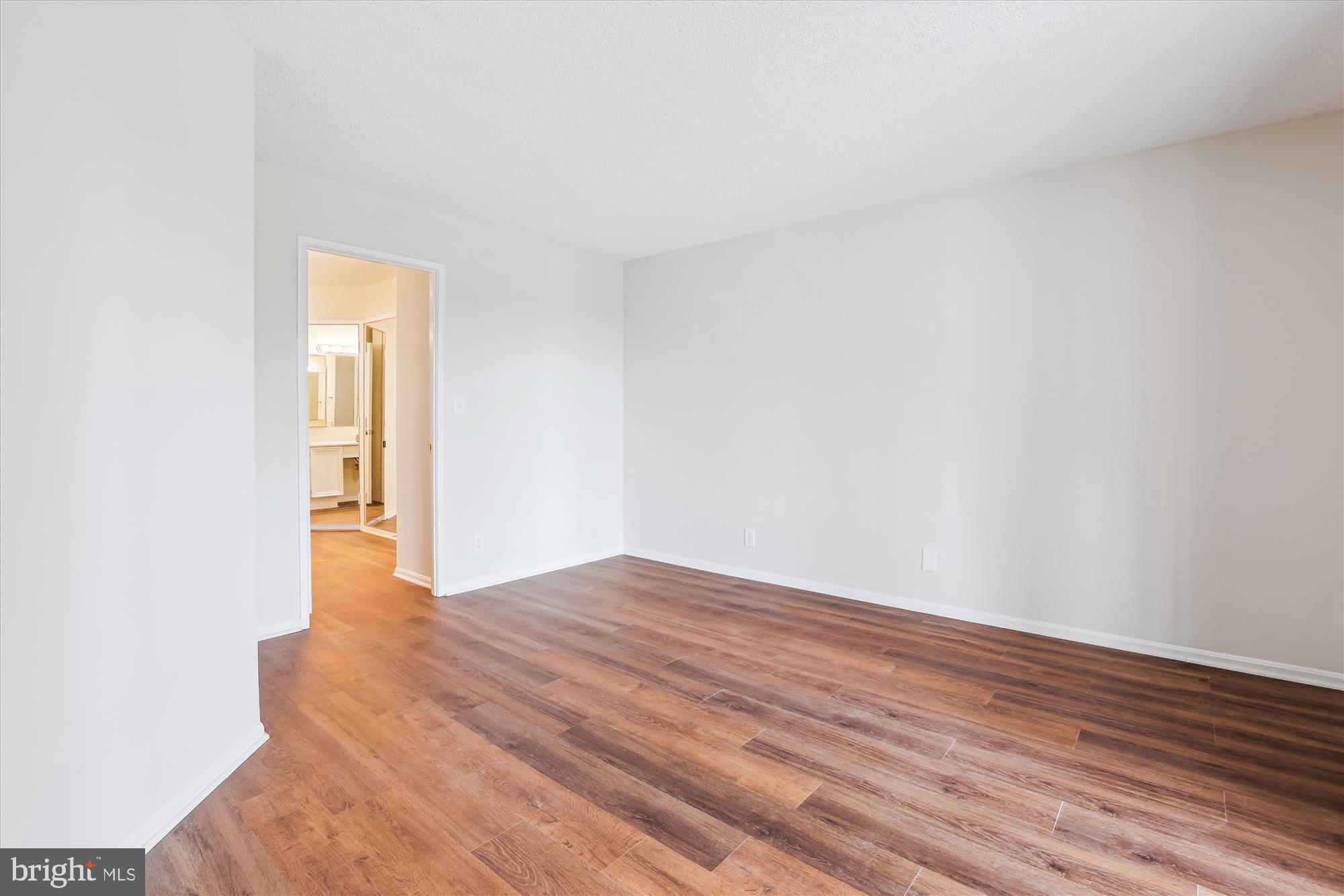 5904 Mt Eagle Drive, Unit 1109 Alexandria, VA 22303 - Photo 15 of 43 a view of an empty room and wooden floor