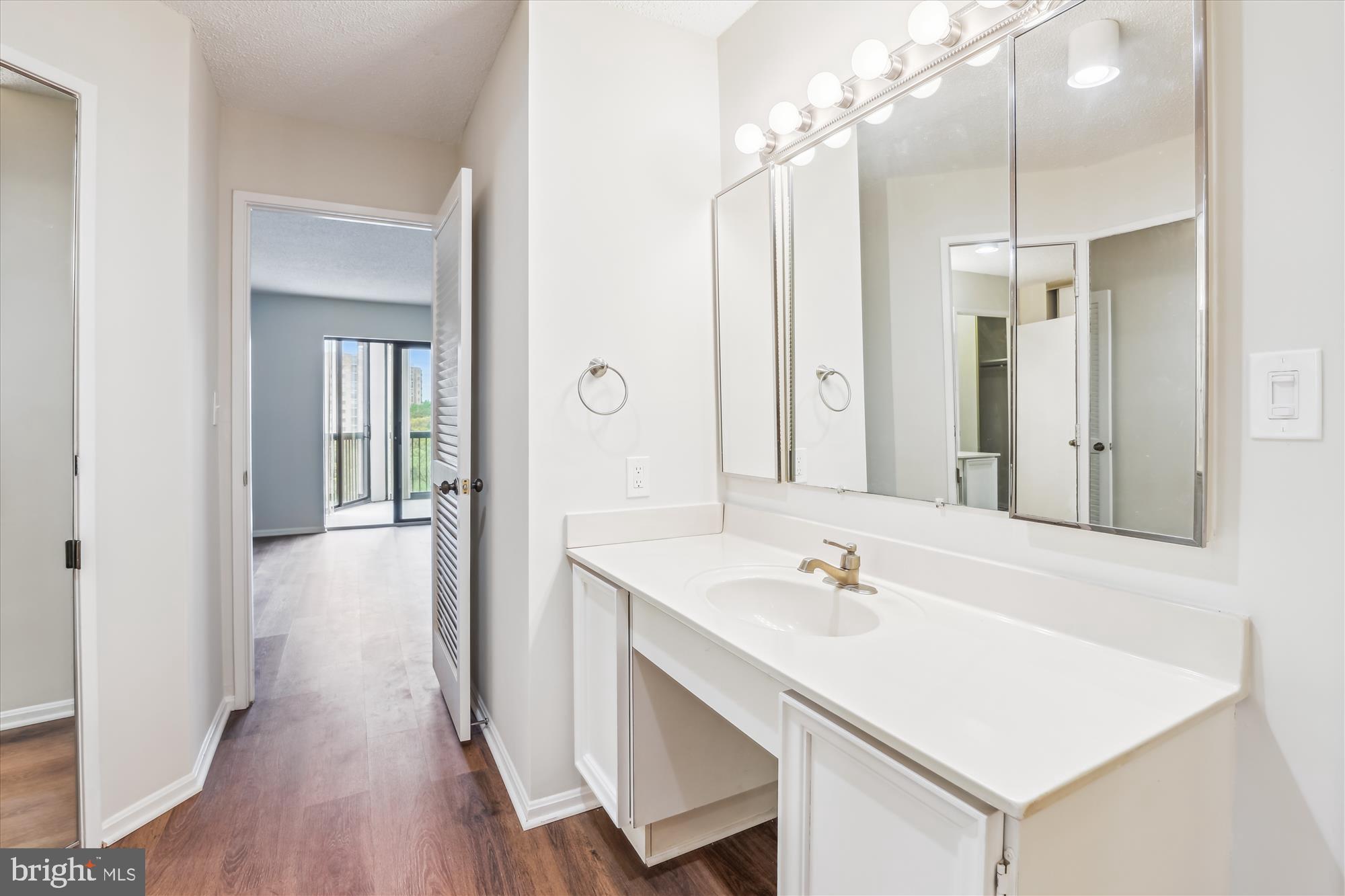 5904 Mt Eagle Drive, Unit 1109 Alexandria, VA 22303 - Photo 17 of 43 a en suite bathroom with a sink a mirror and a shower