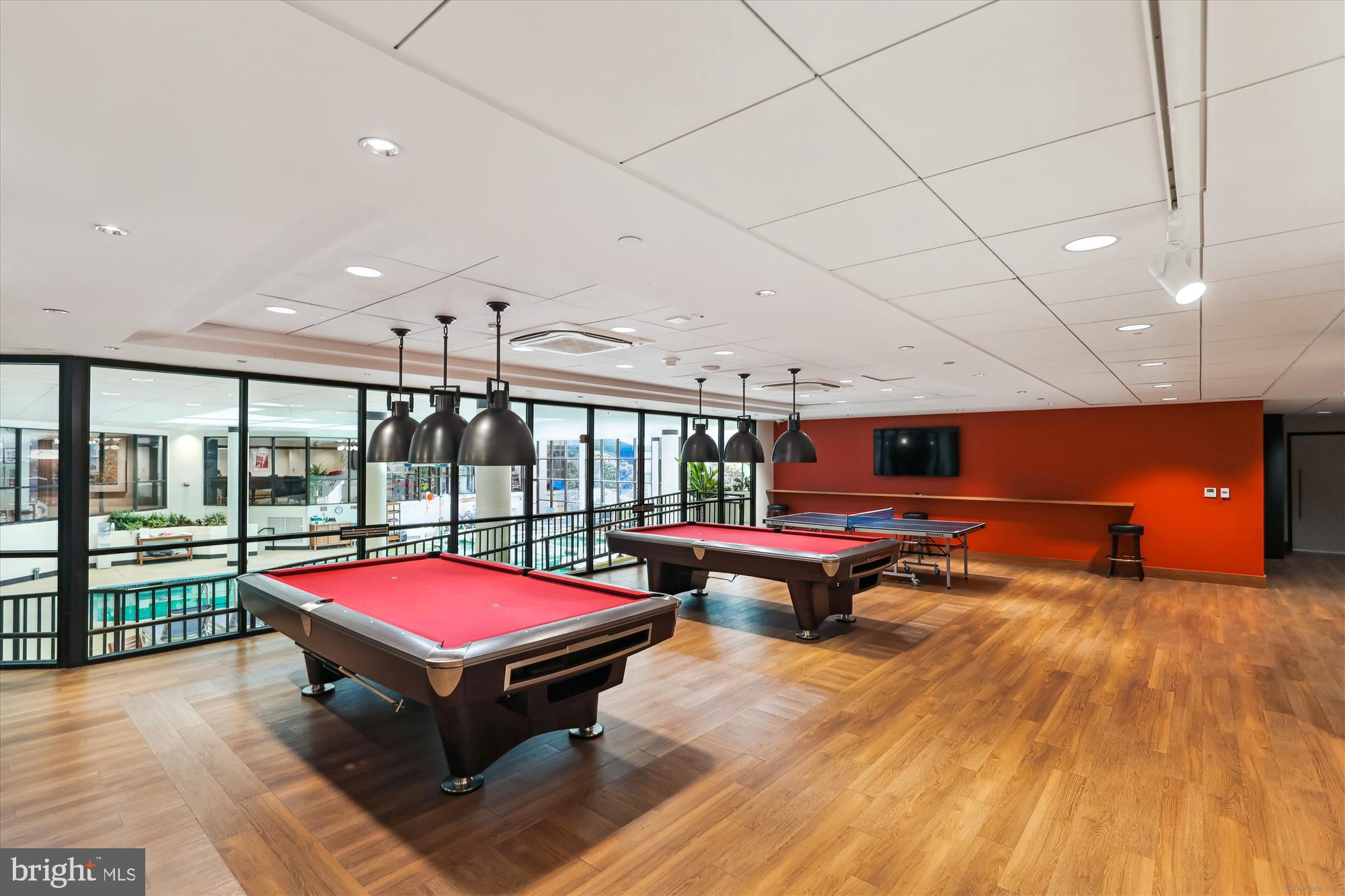 5904 Mt Eagle Drive, Unit 1109 Alexandria, VA 22303 - Photo 33 of 43 a living room with furniture pool table wooden floor and windows