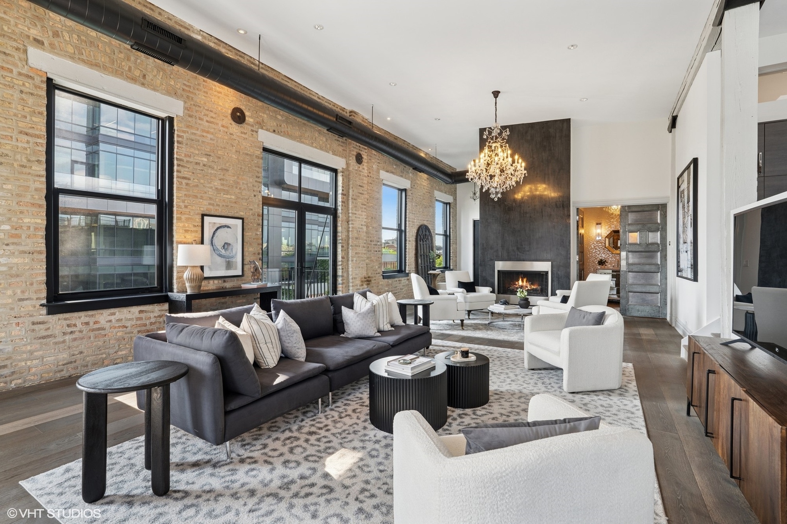 401 North Aberdeen Street, Unit 4S Chicago, IL 60642 - Photo 14 of 33 a living room with fireplace furniture and a chandelier