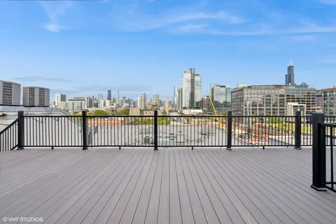 a view of a balcony with wooden floor