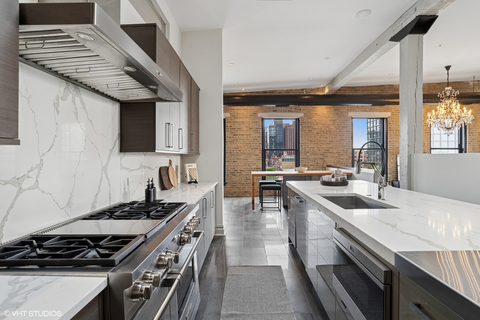 401 North Aberdeen Street, Unit 4S Chicago, IL 60642 - Photo 7 of 33 a kitchen with stainless steel appliances granite countertop a sink stove and cabinets