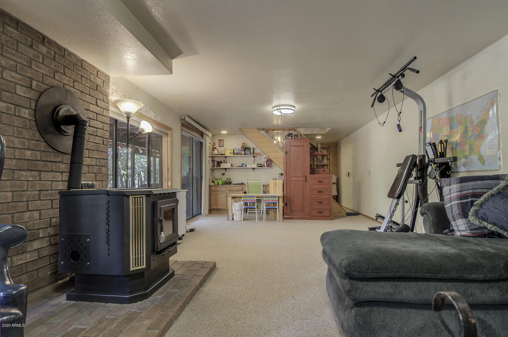 8143 Ralls Drive Strawberry, AZ 85544 - Photo 40 of 74 Lower level family room - pellet stove