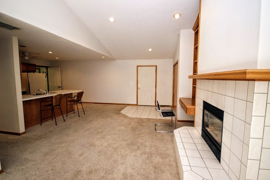 7260 North Alpine Road, Unit 3 Loves Park, IL 61111 - Photo 5 of 14 a living room with furniture and a fireplace