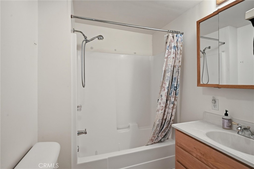 10313 Brookside Drive Middletown, CA 95461 - Photo 12 of 20 a bathroom with a sink a toilet and shower