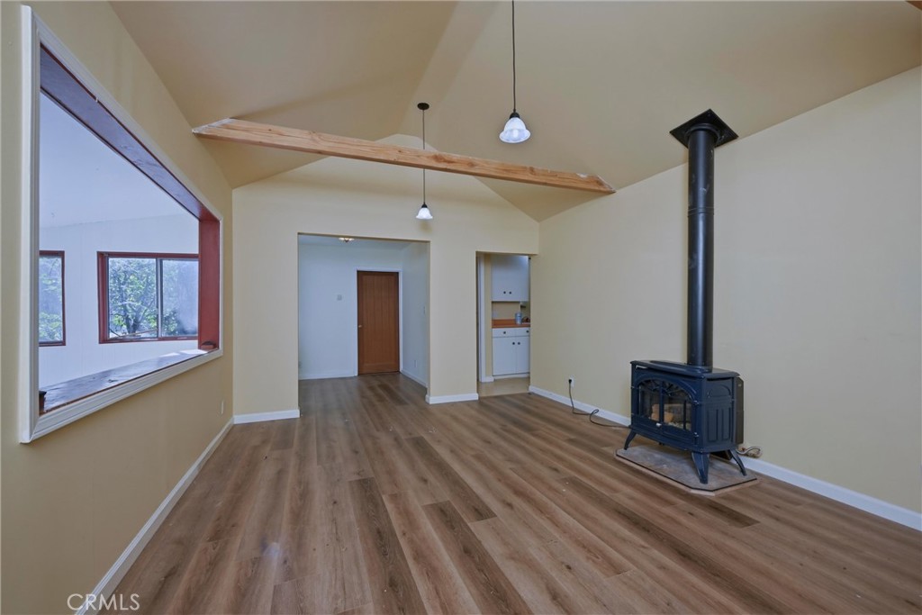 10313 Brookside Drive Middletown, CA 95461 - Photo 6 of 20 a view of an empty room with wooden floor and a window
