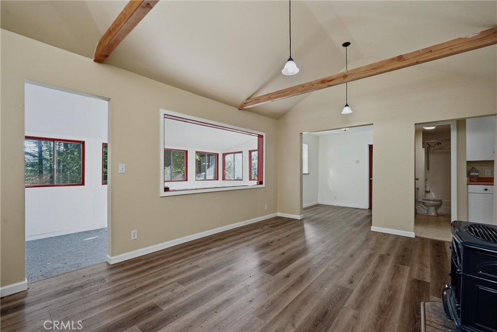 10313 Brookside Drive Middletown, CA 95461 - Photo 7 of 20 a view of an empty room with a window and wooden floor