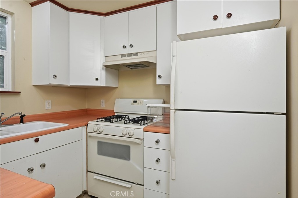 10313 Brookside Drive Middletown, CA 95461 - Photo 10 of 20 a kitchen with a white cabinets and white stove