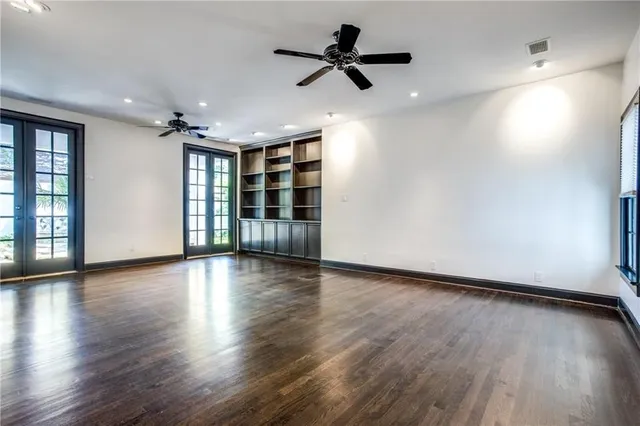 a bathroom with a granite countertop sink mirror vanity and toilet