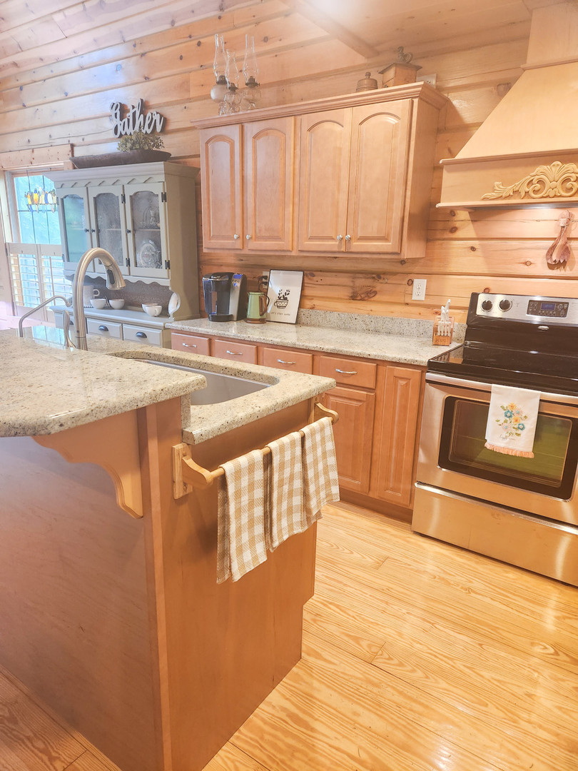 18000 Dee-Mac Road Mackinaw, IL 61755 - Photo 3 of 39 a kitchen with stainless steel appliances granite countertop a sink and cabinets