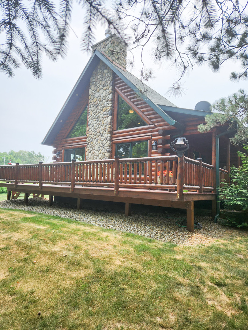 18000 Dee-Mac Road Mackinaw, IL 61755 - Photo 33 of 39 a view of a house with roof deck and sitting area