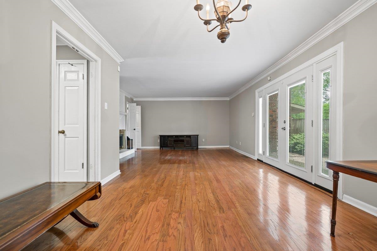 6942 Amberly Road, Unit 6942 Memphis, TN 38119 - Photo 10 of 23 a view of empty room with wooden floor and fan