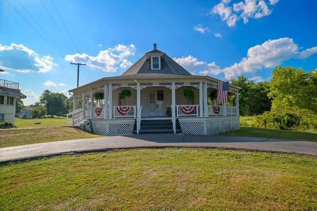 a room with wooden floor and furniture