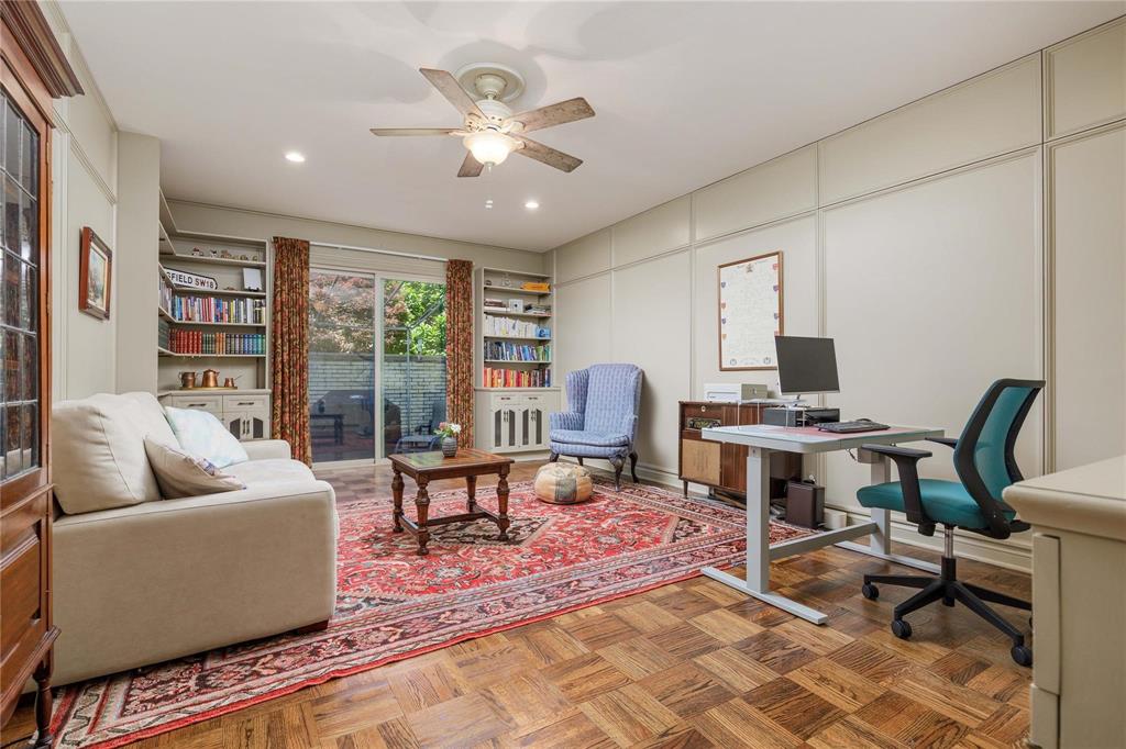 6126 Averill Way, Unit 103W Dallas, TX 75225 - Photo 12 of 34 a living room with furniture and a large window