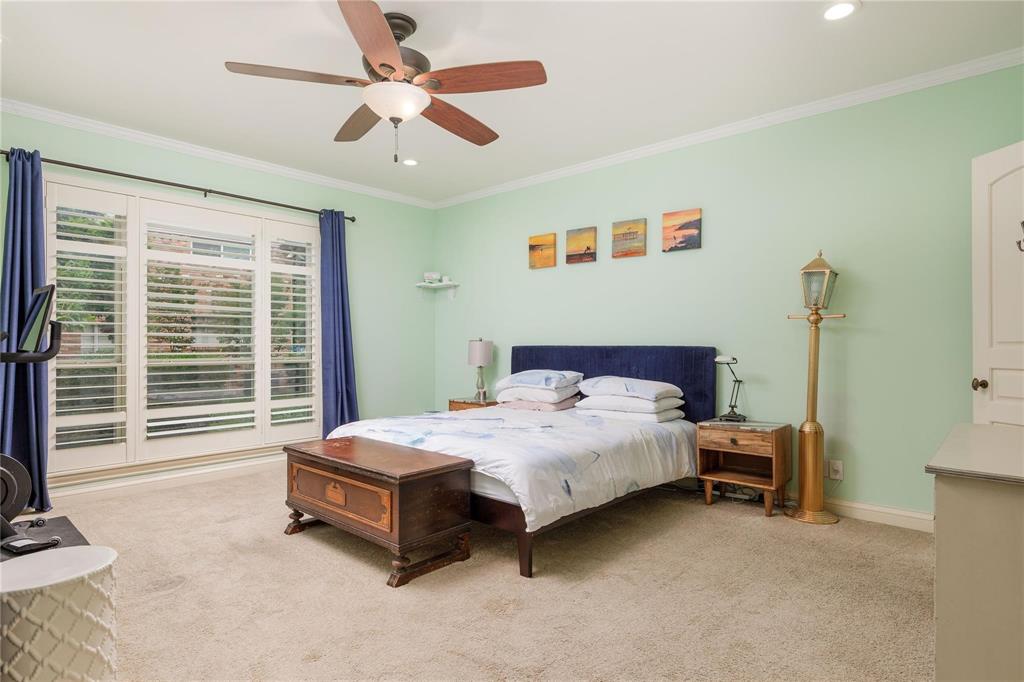 6126 Averill Way, Unit 103W Dallas, TX 75225 - Photo 18 of 34 a bedroom with a bed and a window