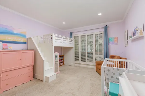 a bed room with a bed and a window