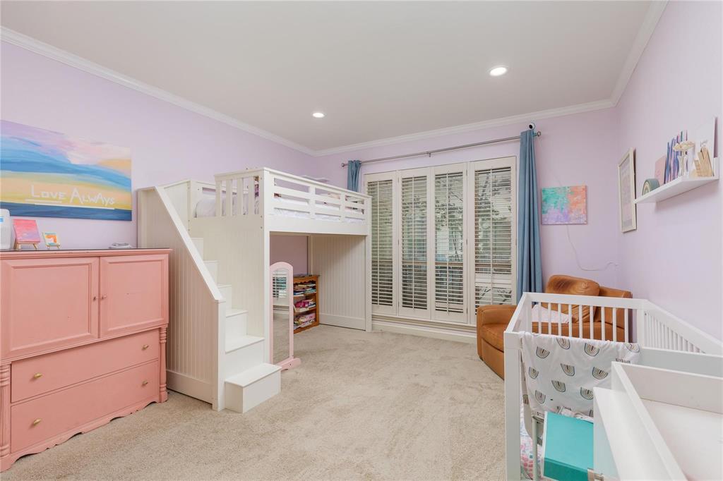 6126 Averill Way, Unit 103W Dallas, TX 75225 - Photo 24 of 34 a bed room with a bed and a window