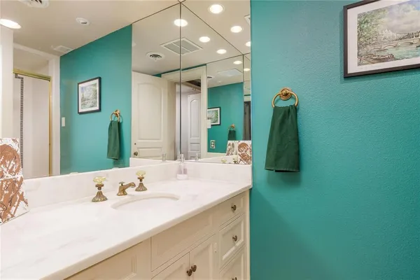 a bathroom with a sink double vanity and a mirror