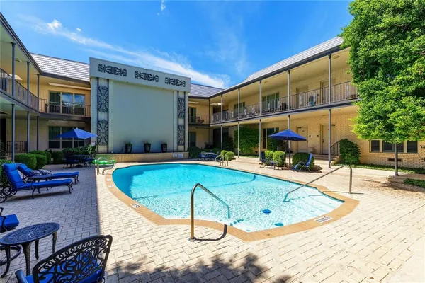 a view of a swimming pool with a patio