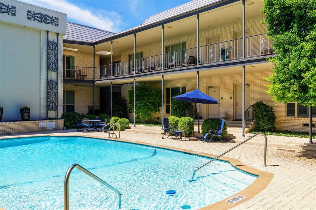 6126 Averill Way, Unit 103W Dallas, TX 75225 - Photo 30 of 34 a building outdoor space with patio view mirror and potted plants