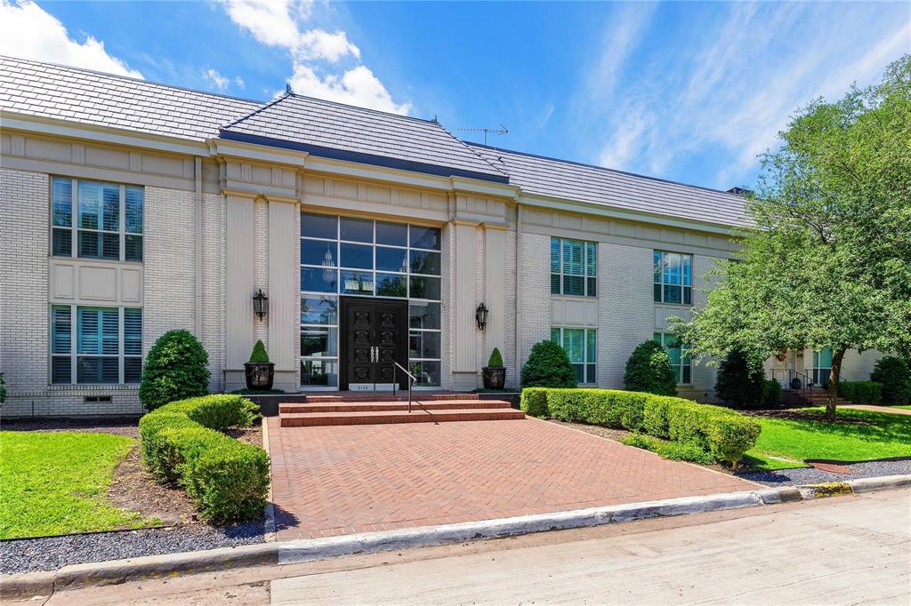 6126 Averill Way, Unit 103W Dallas, TX 75225 - Photo 33 of 34 front view of a house with a yard