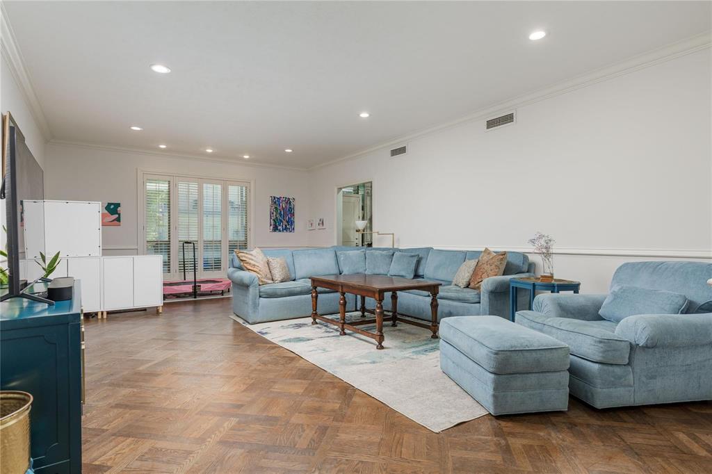 6126 Averill Way, Unit 103W Dallas, TX 75225 - Photo 7 of 34 a living room with furniture and a table
