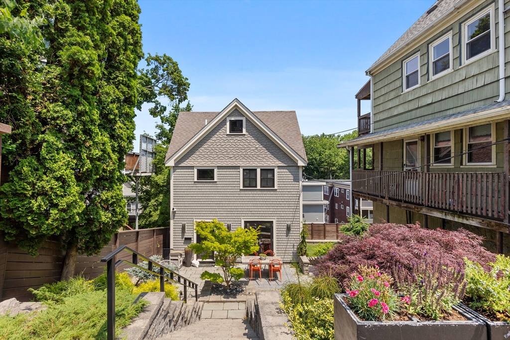 62 Grampian Way, Unit STUDIO Boston, MA 02125 - Photo 24 of 25 a front view of a house with a yard