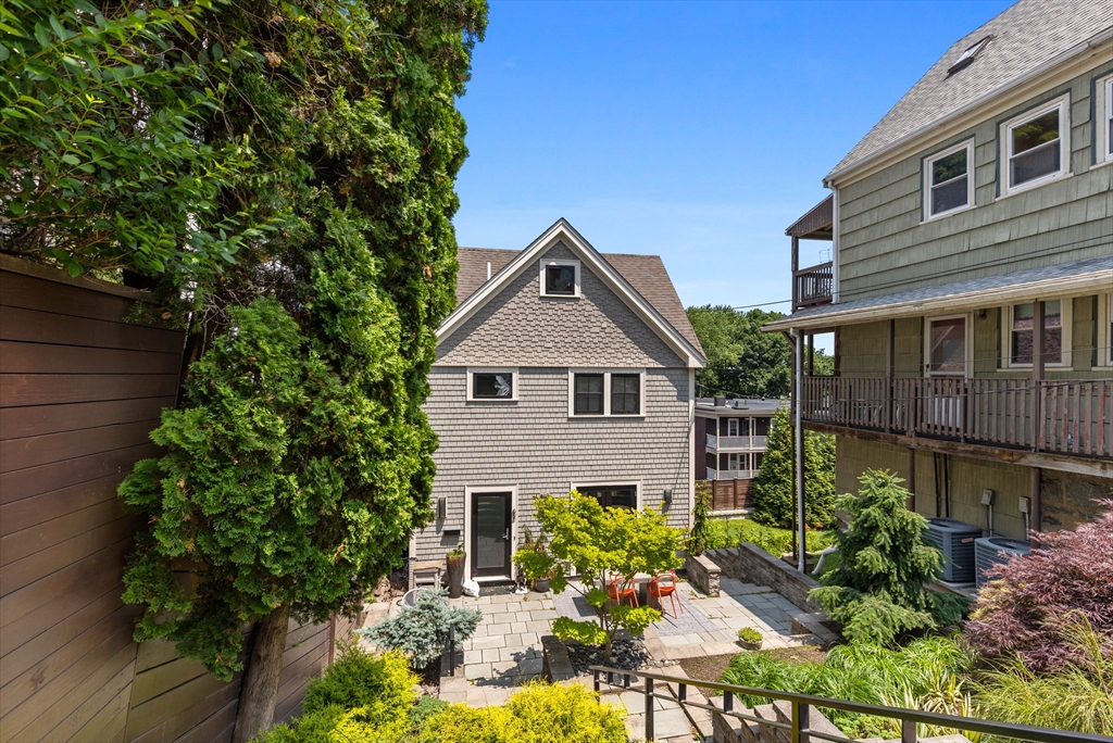 62 Grampian Way, Unit STUDIO Boston, MA 02125 - Photo 25 of 25 a house view with a garden space