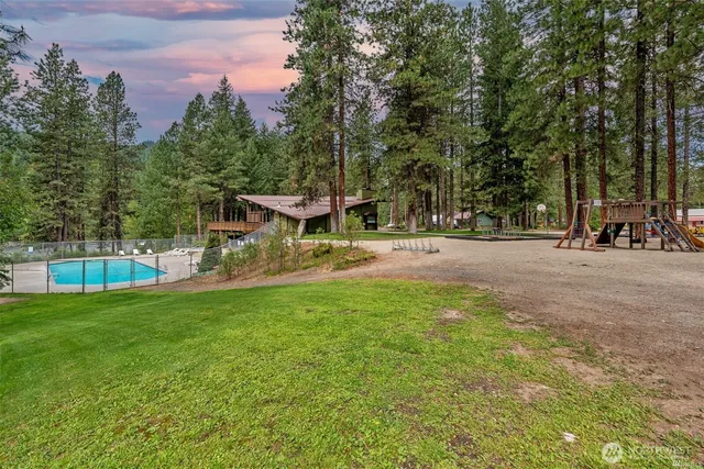 a view of a park with swings and slides