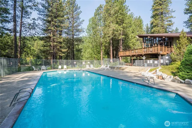 a view of a swimming pool with a patio