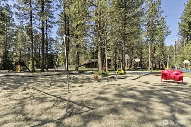 a view of a playground with basketball court