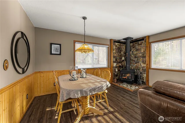 a living room with furniture a window and a chandelier