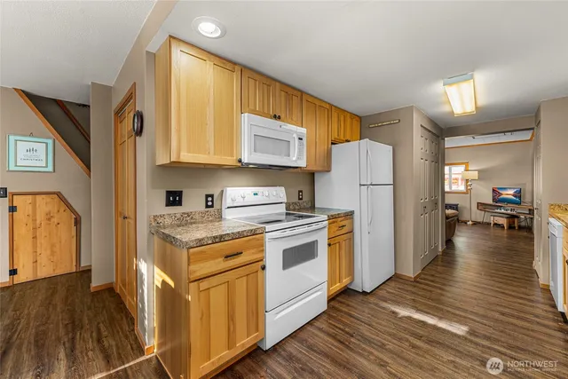 a kitchen with a stove a refrigerator and a stove