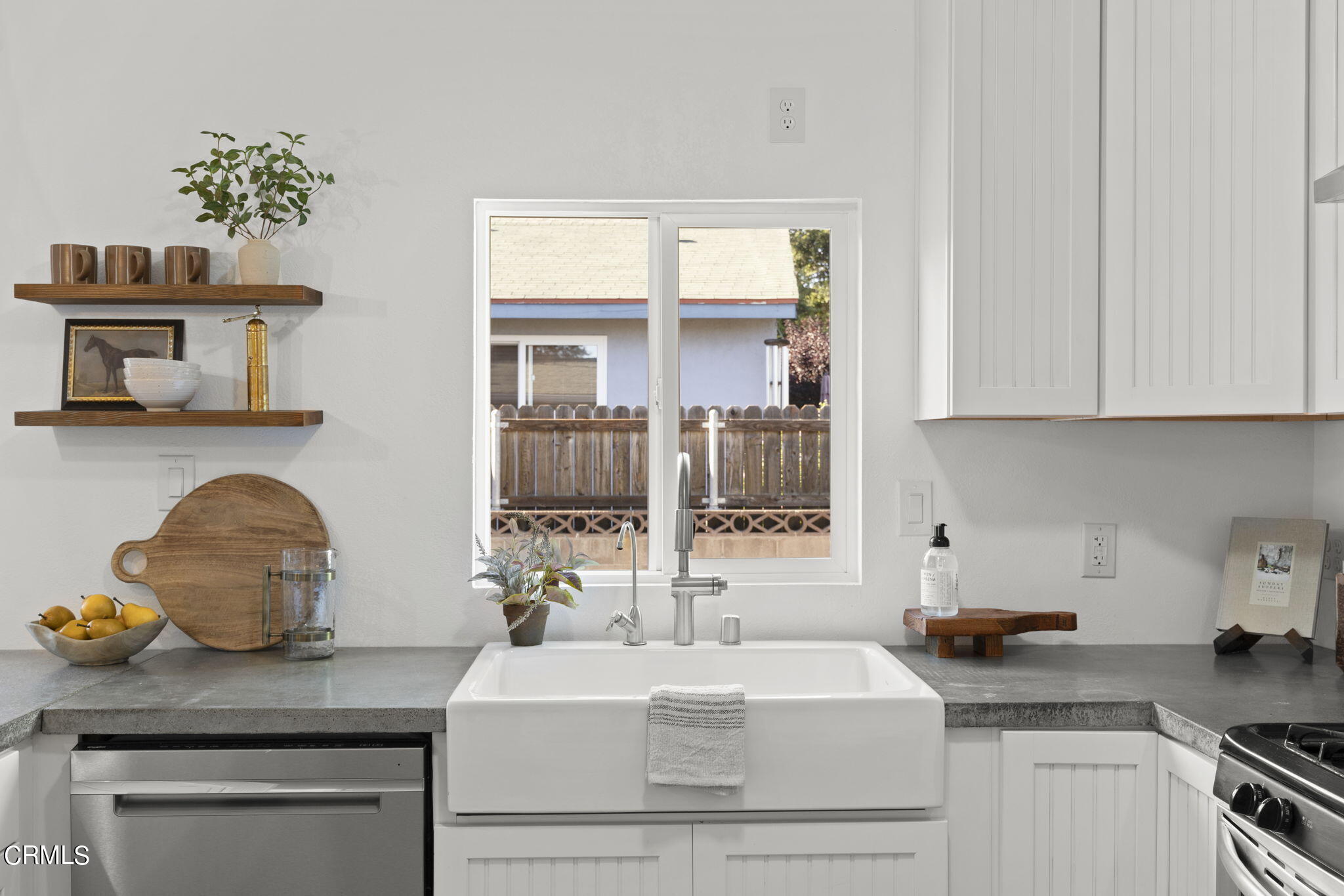 370 Prospect Street Oak View, CA 93022 - Photo 13 of 46 a kitchen with a sink cabinets and window
