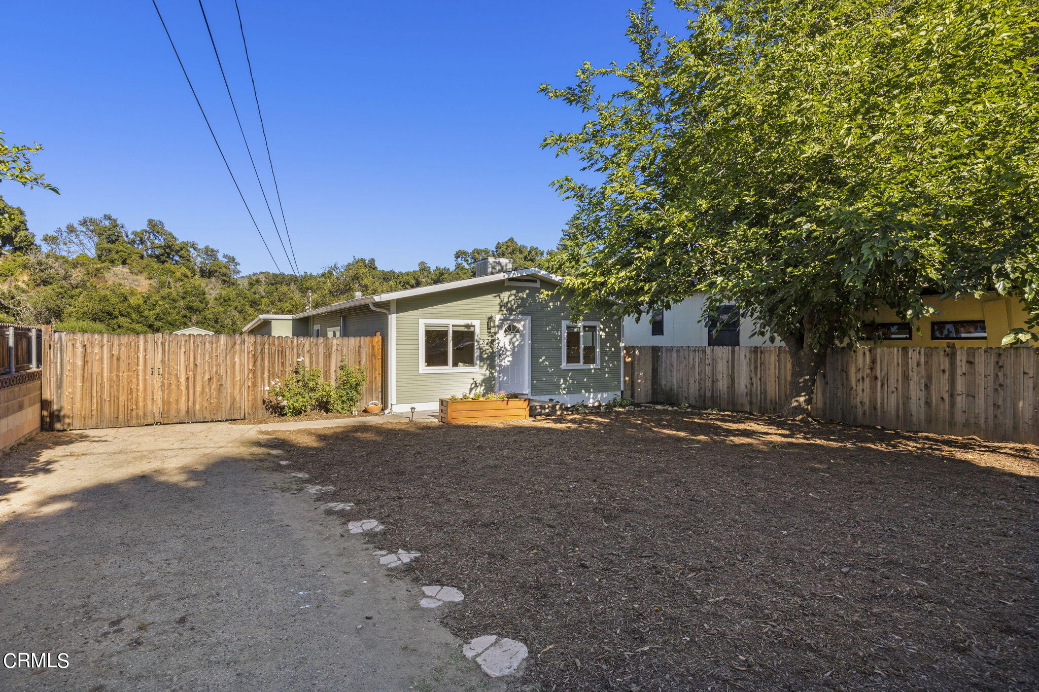 370 Prospect Street Oak View, CA 93022 - Photo 2 of 46 a backyard of a house with table and chairs