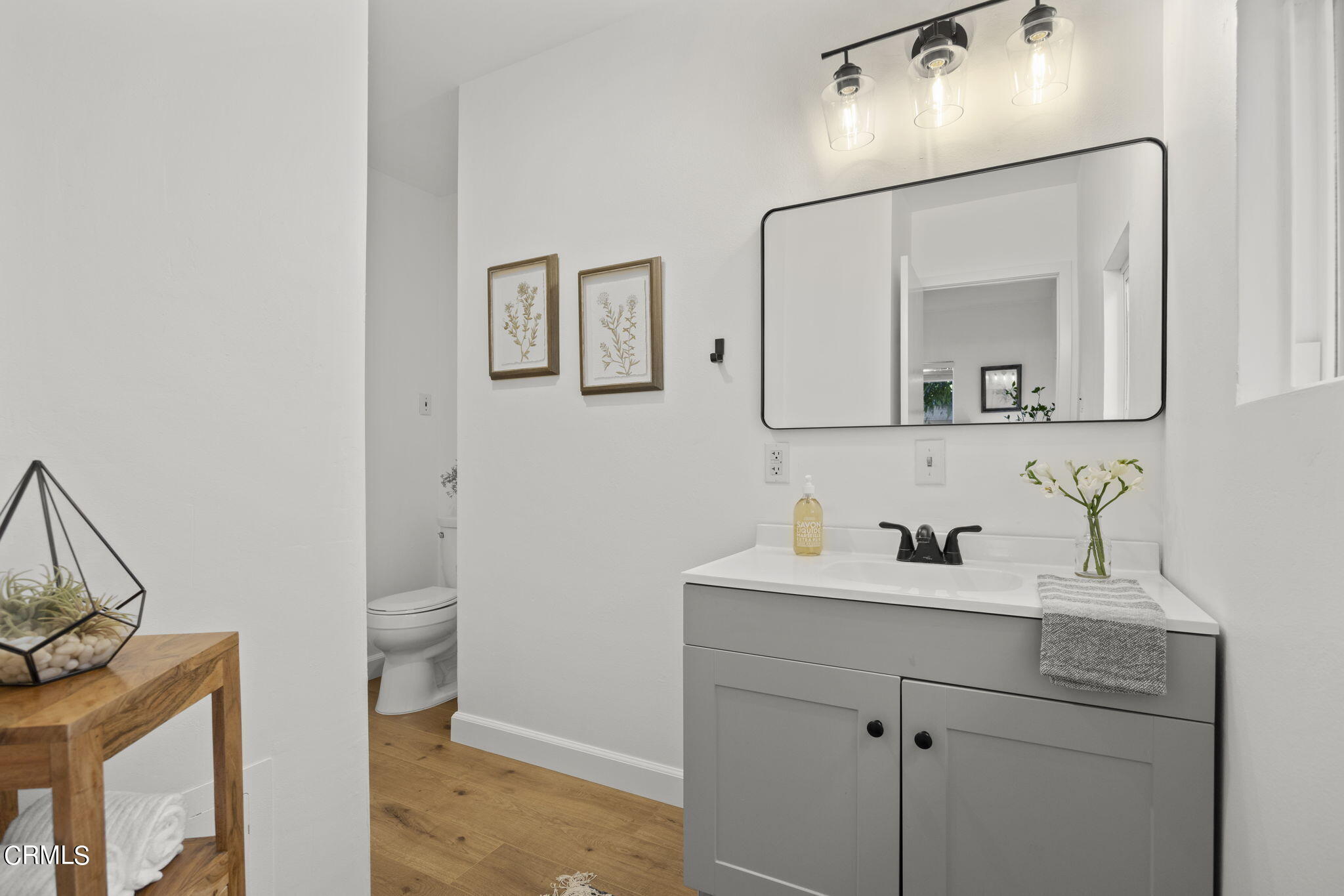 370 Prospect Street Oak View, CA 93022 - Photo 24 of 46 a bathroom with a toilet sink and mirror