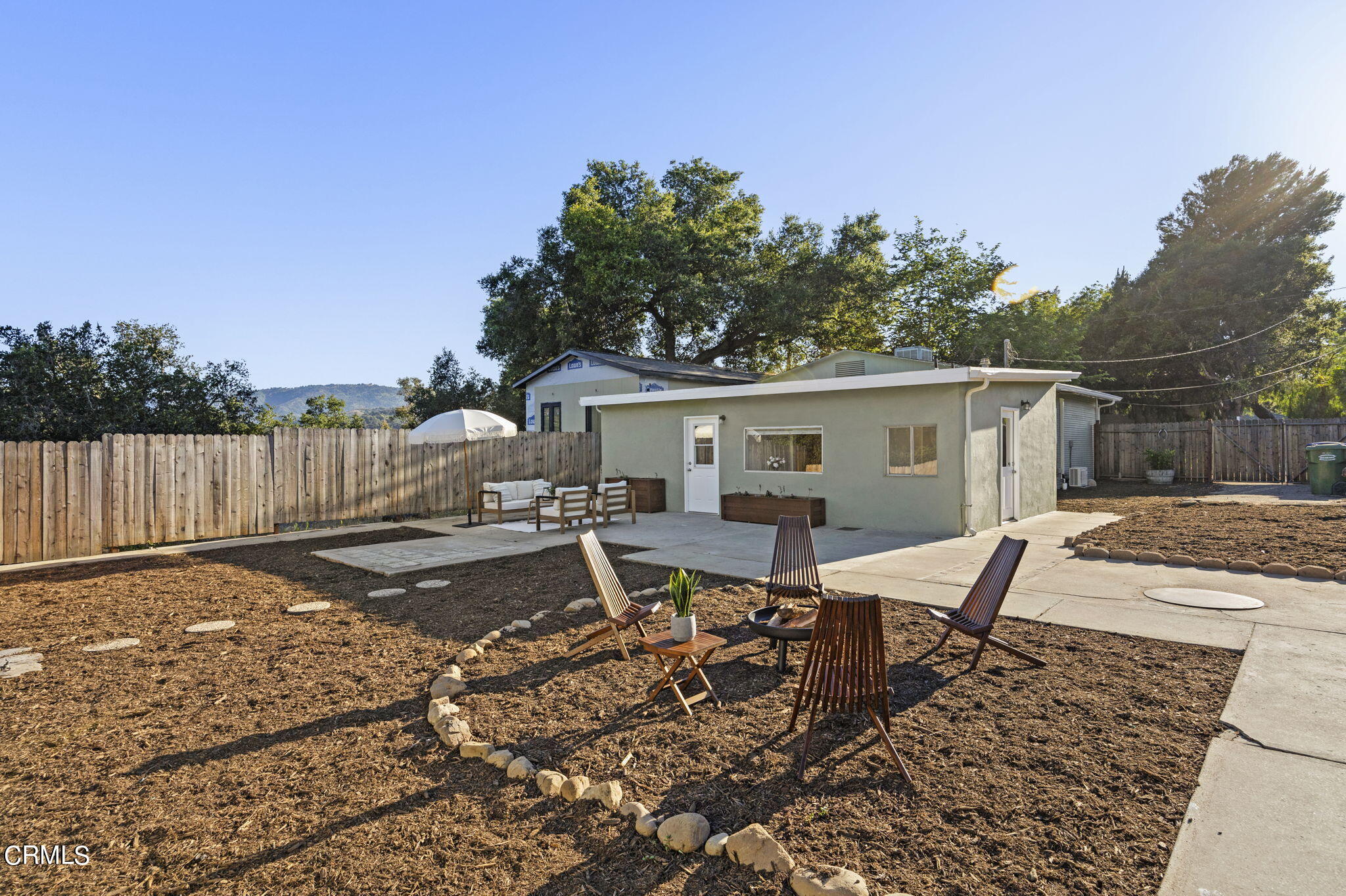 370 Prospect Street Oak View, CA 93022 - Photo 35 of 46 a backyard of a house with table and chairs